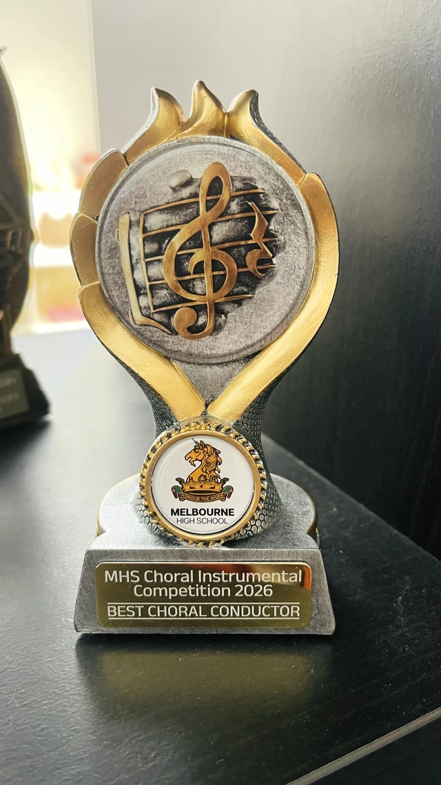Original Melbourne High School trophy inscribed MHS Choral Instrumental Competition 2026, Best Choral Conductor
