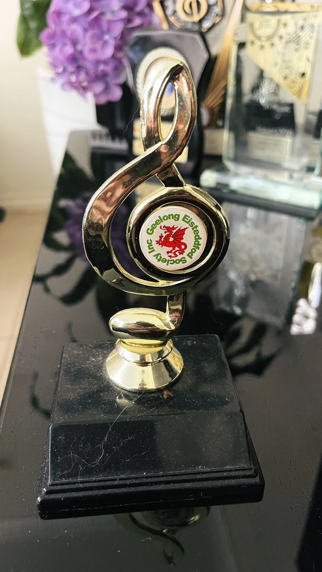 A treble-clef trophy bearing the Geelong Eisteddfod emblem